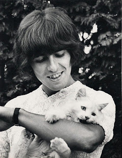 George Harrison with a white cat