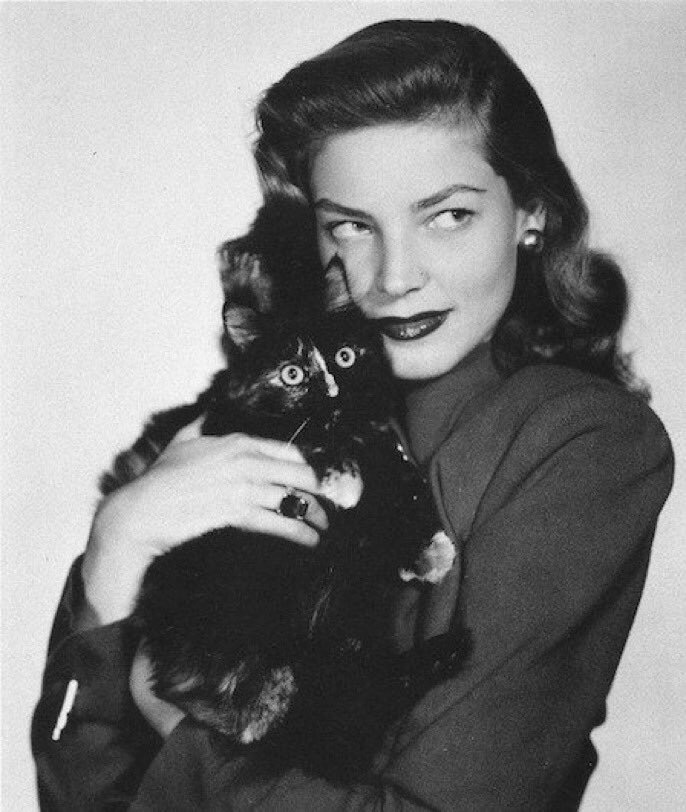 Lauren Bacall with a cat. 