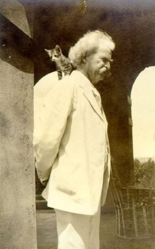 Mark Twain with a cat. 