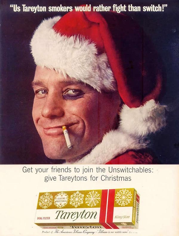 Vintage Christmas Cigarette ad with a smoking Santa and a black eye. Tareyton cigarettes ad. 